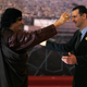 Assad greets Libya’s Muammar Gaddafi, a fellow dictator imperiled by Bush’s democracy promotion.